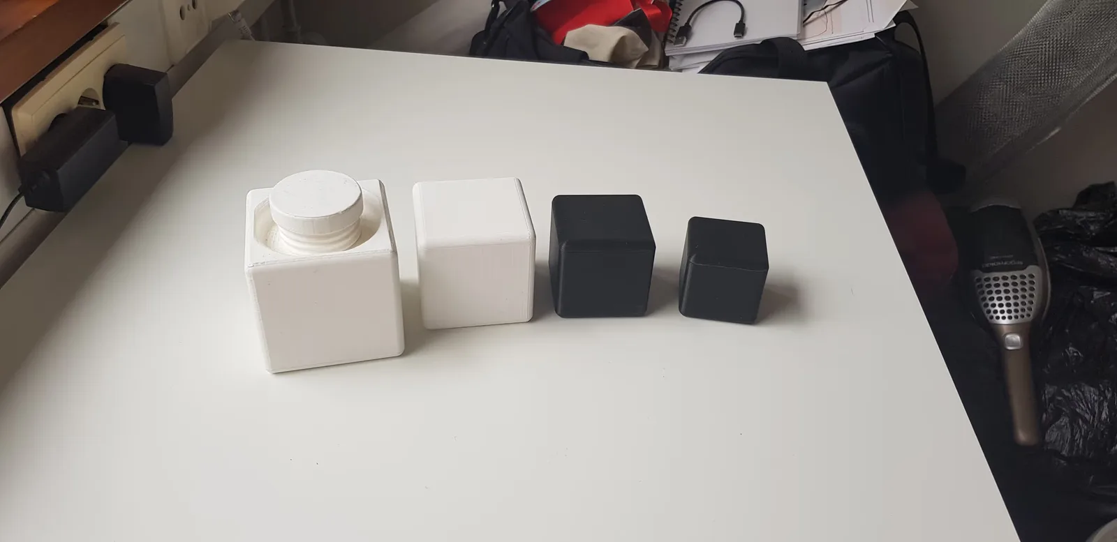 A photo of the four different box sizes together, visualizing their size difference.