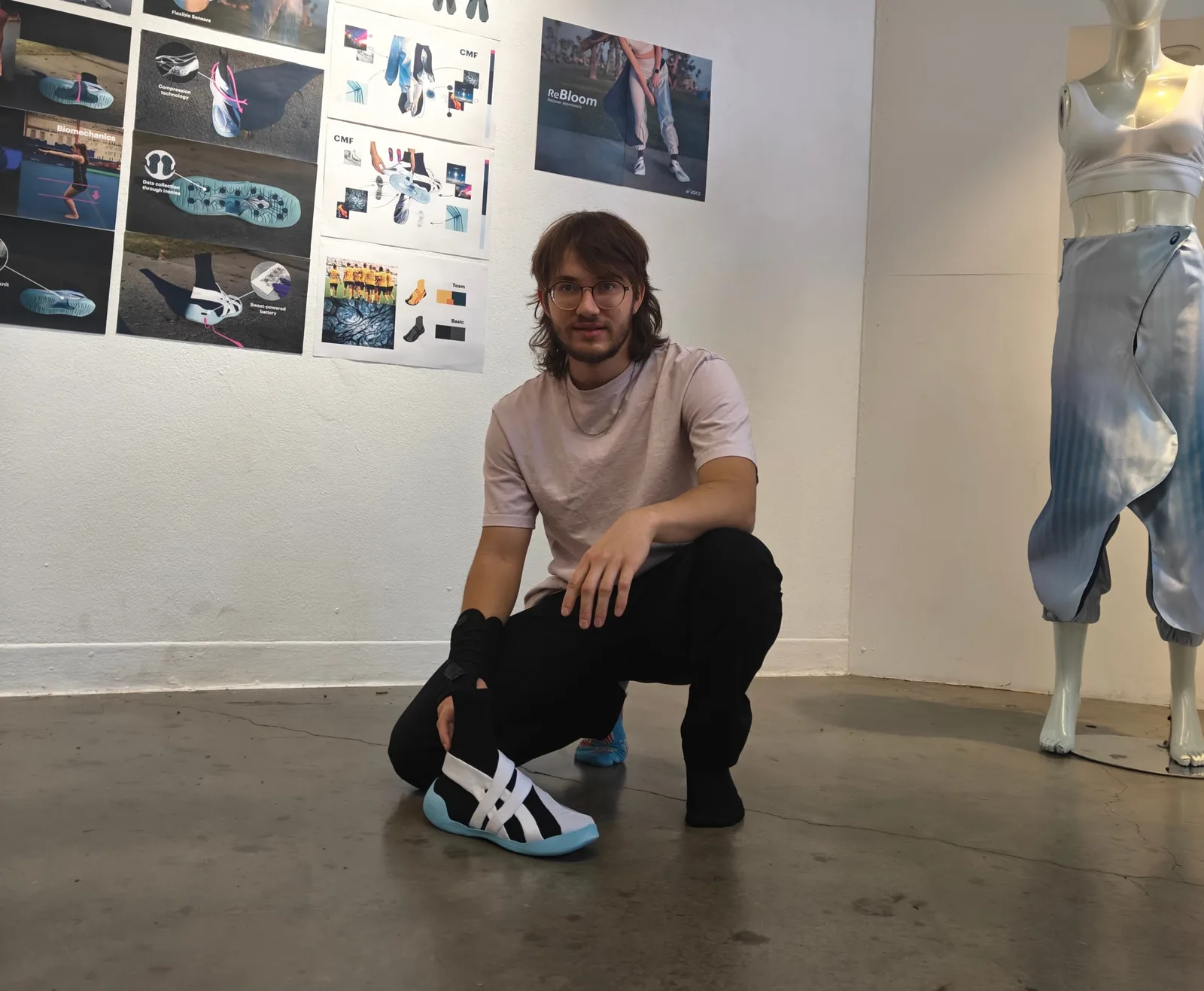 A picture of Radovan at the final project showcase together with the shoe and the pants
