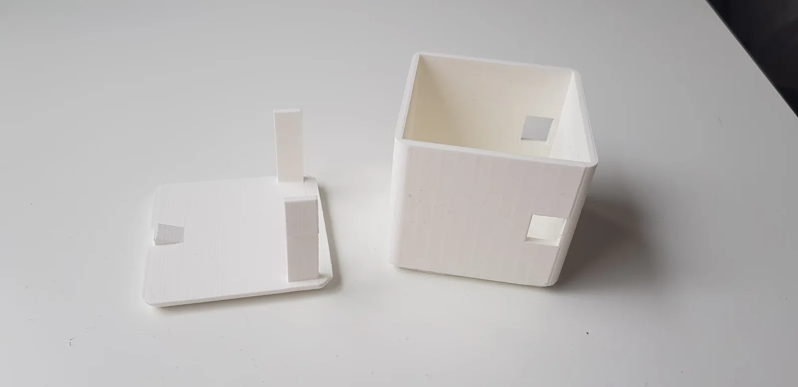 A photo of one of the 3D printed prototypes of the box, testing the large locking mechanism.