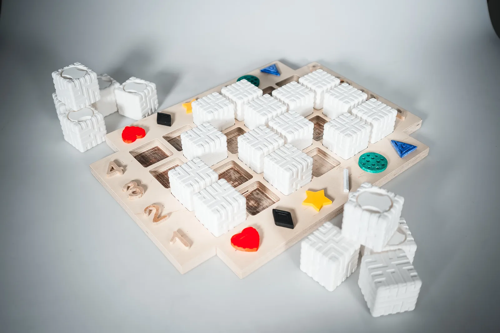 Photo of the visually impaired project game board as if it is being played by two players