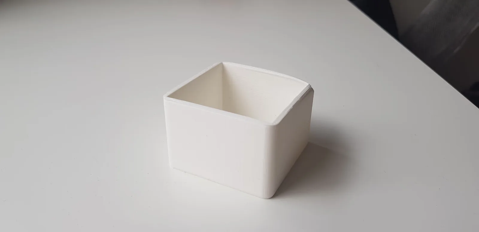 A photo of one of the 3D printed prototypes of the box showing the imperfections 3D printing might have.
